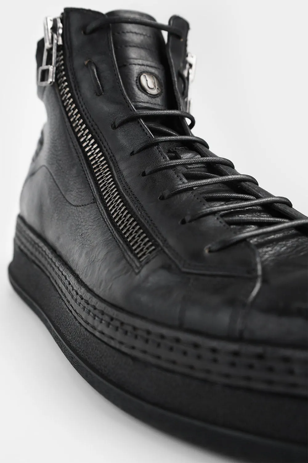 COLE rugged-black double-zip welted high sneakers.
